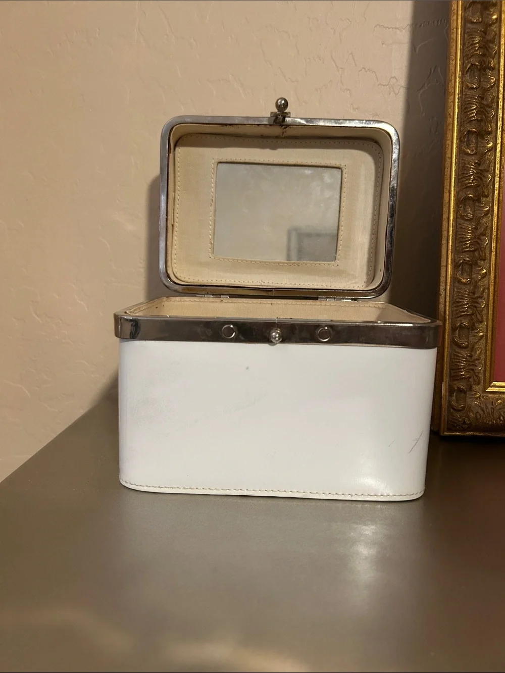 Vintage women’s train case. Would make a cute purse.